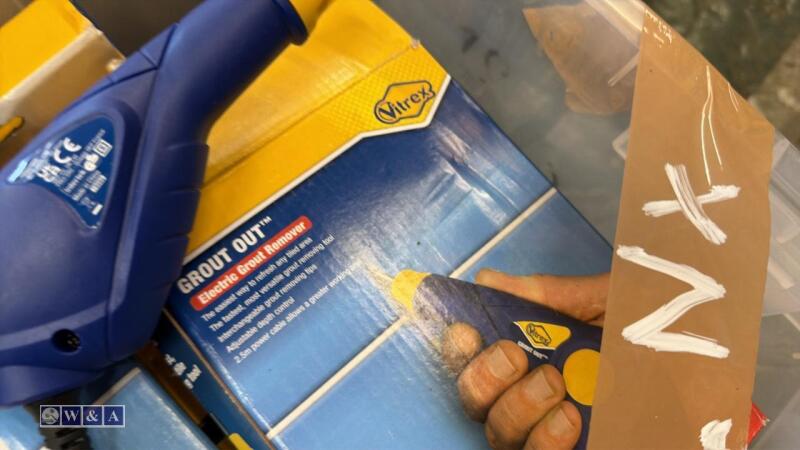 Box of 240v electrical grout remover