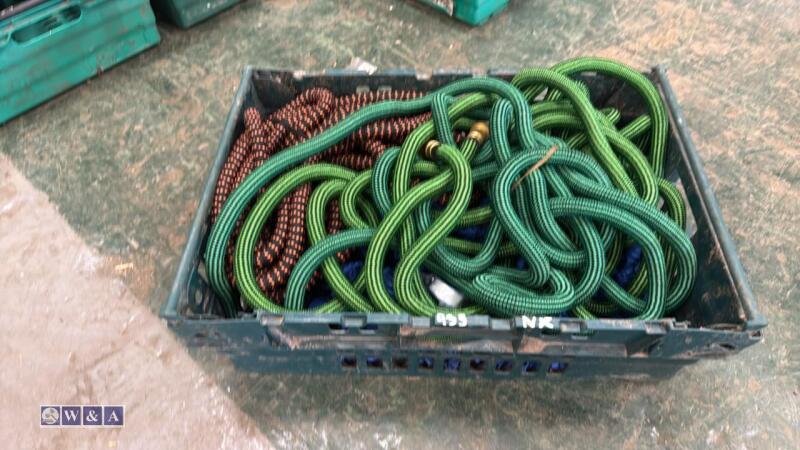 Tray of expandable garden hoses