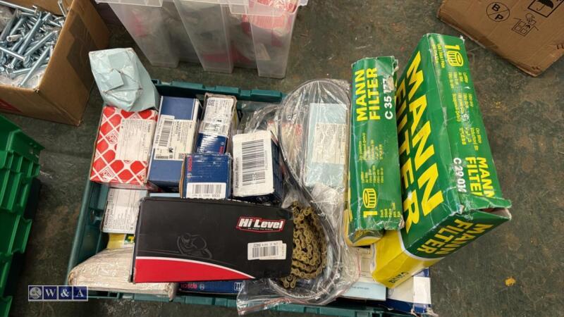Tray of car parts, filters, brake pads, belts