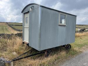 HIRSTLE FABRICATIONS Shepherds hut built on iron wheeled turntable chassis (12ft x 7ft) (to be sold off site Huddersfield HD5)