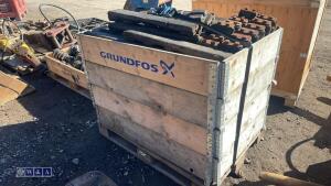 Crate of excavator track pads