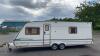 2002 ABBEY SPECTRUM caravan c/w full size awning, fixed bed pull out, double bed at the front, toilet, shower, cooker, fridge (keys in office) - 2