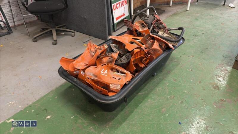 Quantity of STIHL saw housings in plastic mix tub