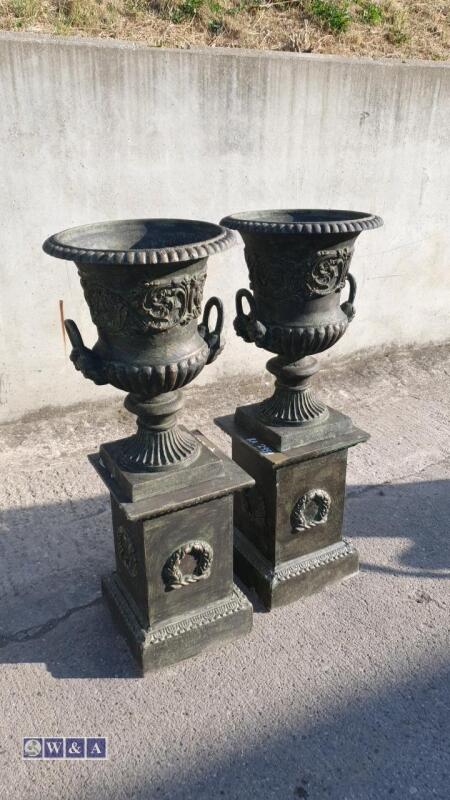 Pair of cast iron urns (bronze green finish) & stands