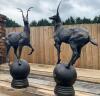 Pair of cast iron deer gate post finials