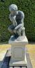 Bronze statue of ''the thinker by Auguste Rodin gates of hell paris'' on cast stone plynth